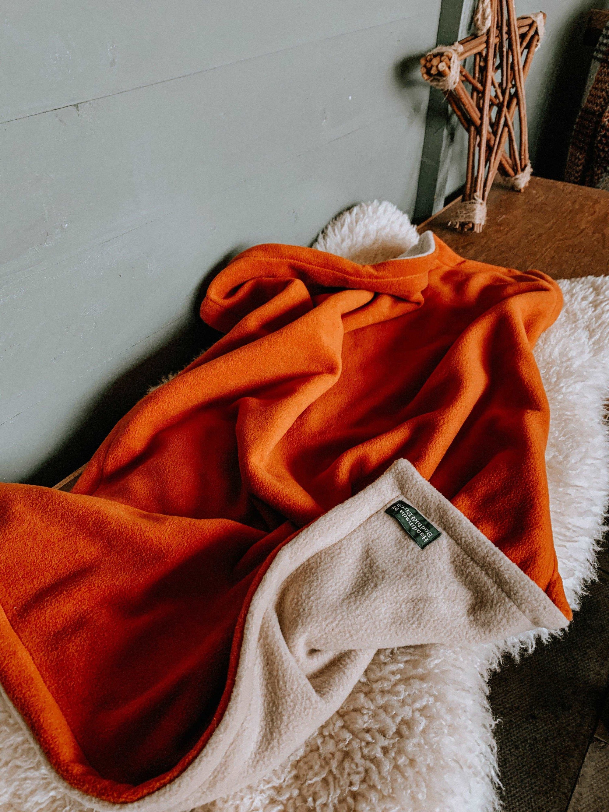 Bodhi & The Birchtree burnt orange anti pill fleece dog blanket. Handmade in Scotland.